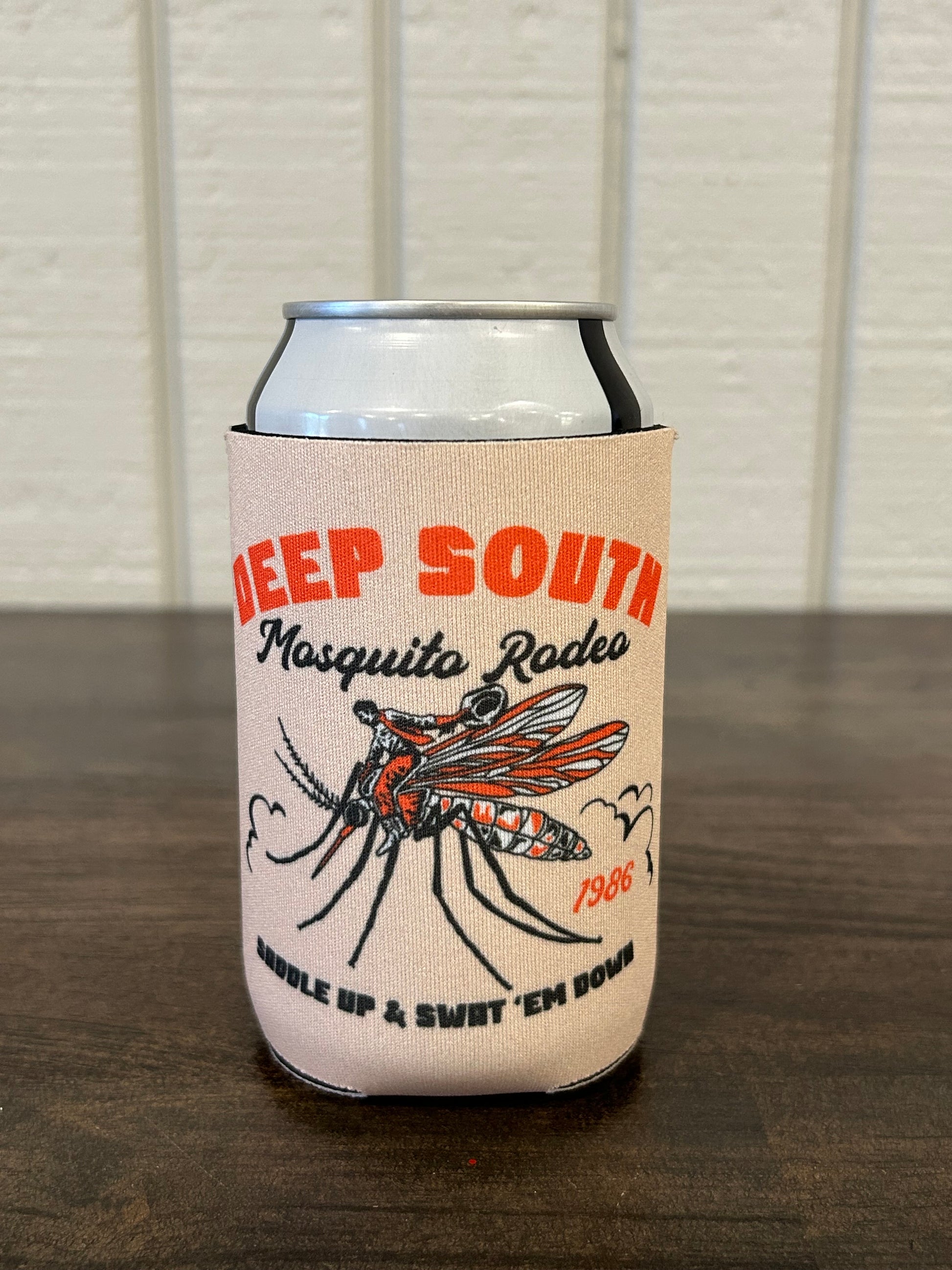 Cream Can Cooler with orange and black text and image with words Deep South Mosquito Rodeo Saddle Up & Swat 'Em Down with cowboy riding a mosquito