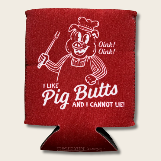 A red can cooler sleeve featuring a white graphic of a pig character holding a fork, with the text 'Oink! Oink!' and 'I LIKE Pig Butts AND I CANNOT LIE!' on a light beige background.