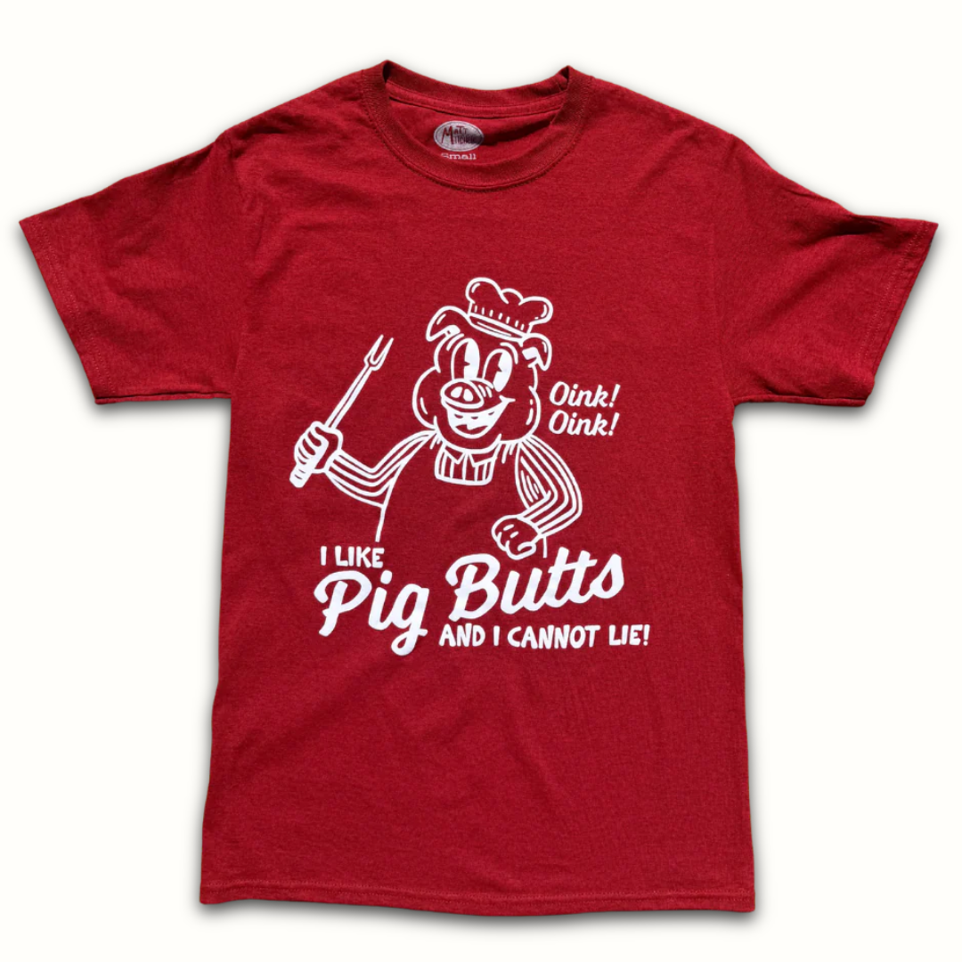 Red I Like Pig Butts t-shirt with cartoon pig pitmaster graphic and bold white text on white background